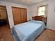 Bedroom with carpet, a blue bedspread, and a small closet at 3282 S Conservation Club Rd, Morgantown, IN 46160