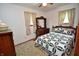 Bedroom with a charming quilt-covered bed, dresser, and ample natural light at 3282 S Conservation Club Rd, Morgantown, IN 46160
