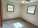 Bedroom with wall to wall carpet features two windows, and neutral colored walls at 3282 S Conservation Club Rd, Morgantown, IN 46160