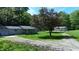 Charming home featuring a well-maintained lawn and a gravel driveway, surrounded by mature trees at 3282 S Conservation Club Rd, Morgantown, IN 46160