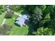 Aerial view of home featuring a deck, well maintained landscaped yard and surrounded by mature trees at 3282 S Conservation Club Rd, Morgantown, IN 46160