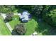 Overhead view of home featuring a deck, playhouse, and well maintained landscaped yard at 3282 S Conservation Club Rd, Morgantown, IN 46160