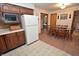 Traditional kitchen boasts wood cabinets and white appliances at 3282 S Conservation Club Rd, Morgantown, IN 46160