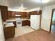 Efficient kitchen layout with plentiful cabinets and counter space, plus modern white appliances at 3282 S Conservation Club Rd, Morgantown, IN 46160