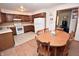 Traditional kitchen boasts wood cabinets and white appliances at 3282 S Conservation Club Rd, Morgantown, IN 46160