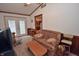 The cozy living room has access to the kitchen and outdoor patio at 3282 S Conservation Club Rd, Morgantown, IN 46160