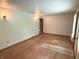 The open living room with wood floors offers ample natural light and access to additional rooms at 3282 S Conservation Club Rd, Morgantown, IN 46160