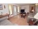 Bright living room featuring hardwood floors, neutral paint, and lots of furniture at 3282 S Conservation Club Rd, Morgantown, IN 46160