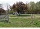 View of the property's exterior with a small house at 3282 S Conservation Club Rd, Morgantown, IN 46160