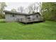 Backyard view of the home with a grill and weathered wooden deck at 3282 S Conservation Club Rd, Morgantown, IN 46160