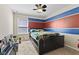 Bedroom featuring a statement wall with carpet flooring at 3311 Stoddard Pl, Indianapolis, IN 46217