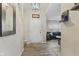 Foyer with plank flooring leading to the living room at 3311 Stoddard Pl, Indianapolis, IN 46217