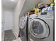 Modern laundry room with new washer and dryer and plenty of storage at 3311 Stoddard Pl, Indianapolis, IN 46217