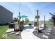 An outdoor patio featuring a grill area, a bar, and a fire pit, perfect for entertaining guests at 3311 Stoddard Pl, Indianapolis, IN 46217