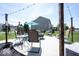 Patio with outdoor seating, fire pit, and string lights creating a cozy atmosphere at 3311 Stoddard Pl, Indianapolis, IN 46217
