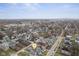 Wide angle aerial view of neighborhood with property marker, city skyline in background at 3331 Graceland Ave, Indianapolis, IN 46208