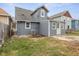 Exterior elevation of home with a yard, blue siding, and a grey roof at 3331 Graceland Ave, Indianapolis, IN 46208