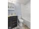 Bathroom with fresh paint, wood vanity, and shower and tub combination at 3331 Graceland Ave, Indianapolis, IN 46208