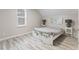 Cozy bedroom featuring wood floors, neutral walls, and a window for natural light at 3331 Graceland Ave, Indianapolis, IN 46208