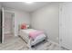 This bedroom showcases wood floors, neutral walls, and a comfy bed at 3331 Graceland Ave, Indianapolis, IN 46208
