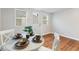 Inviting dining area with a white table setting and wood-look flooring at 3331 Graceland Ave, Indianapolis, IN 46208