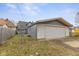 Spacious one car detached garage with extra space for storage, small driveway and lawn area at 3331 Graceland Ave, Indianapolis, IN 46208
