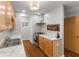 Bright kitchen with marble countertops, stainless steel range hood and wood flooring at 3331 Graceland Ave, Indianapolis, IN 46208