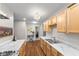 Well-lit kitchen featuring stainless steel appliances, and rich, hardwood floors at 3331 Graceland Ave, Indianapolis, IN 46208