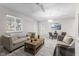 Spacious living room with great natural light, wood floors, and stylish furniture at 3331 Graceland Ave, Indianapolis, IN 46208