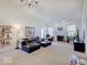 Open-concept living room showcases a fireplace, vaulted ceilings, and natural light at 3480 Limelight Ln, Whitestown, IN 46075