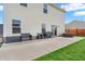 Outdoor patio area features comfortable seating, hot tub and built in barbecue at 401 Shadetree Ln, Sheridan, IN 46069