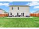 The home's backyard has a patio area, comfortable seating, barbecue, and a hot tub at 401 Shadetree Ln, Sheridan, IN 46069