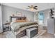 Bedroom with natural light and ceiling fan, wooden floors and comfortable bedding at 401 Shadetree Ln, Sheridan, IN 46069