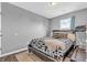 Bedroom with wooden floors, natural light, and view at 401 Shadetree Ln, Sheridan, IN 46069
