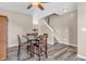 Open dining area with wood floors, a ceiling fan, and a staircase leading to the upper level at 401 Shadetree Ln, Sheridan, IN 46069