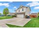 Two-story home features an attached garage and a wide concrete driveway at 401 Shadetree Ln, Sheridan, IN 46069