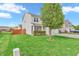 Attractive home with green lawn and manicured shrubbery, complemented by a mature shade tree at 401 Shadetree Ln, Sheridan, IN 46069