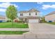 Attractive two-story home with brick and siding facade, lush lawn and large driveway at 401 Shadetree Ln, Sheridan, IN 46069
