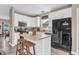Well-lit kitchen with white cabinets, a center island, and modern appliances at 401 Shadetree Ln, Sheridan, IN 46069