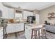 Bright kitchen with white cabinets, a central island, and modern appliances at 401 Shadetree Ln, Sheridan, IN 46069