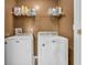 Practical laundry area showcasing a washer, dryer and storage, conveniently organized for efficient chores at 401 Shadetree Ln, Sheridan, IN 46069