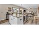 Open-concept kitchen flows into the living room creating a spacious and inviting atmosphere at 401 Shadetree Ln, Sheridan, IN 46069