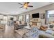 Bright and airy living room connects seamlessly to the kitchen and dining area at 401 Shadetree Ln, Sheridan, IN 46069