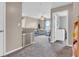 Cozy living room leads to the laundry room at 401 Shadetree Ln, Sheridan, IN 46069