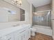 Bathroom features a white vanity, wood-style floor, a gray subway tile surround, and a glass door shower at 403 Fox Ridge Ct, Shelbyville, IN 46176