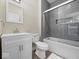 Cozy bathroom boasts a white vanity, gray subway tile shower, and modern fixtures at 403 Fox Ridge Ct, Shelbyville, IN 46176