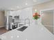 Modern kitchen with stainless steel appliances, white cabinets, and a stylish backsplash at 403 Fox Ridge Ct, Shelbyville, IN 46176