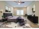 A modern bedroom with a black tufted headboard, black furniture, decor and a large rug, creating a stylish retreat at 403 Fox Ridge Ct, Shelbyville, IN 46176