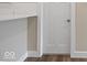 A clean, bright view of a pantry door and a section of the breakfast bar, highlighting modern trim and design at 403 Fox Ridge Ct, Shelbyville, IN 46176