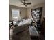 Cozy bedroom with ceiling fan and natural light from the window at 4402 Mountbatten Ct, Indianapolis, IN 46254
